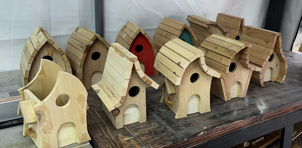 Raw, unpainted whimsical birdhouses waiting to be painted